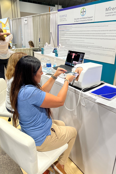 Residents performing a test procedure at a booth during the conferences