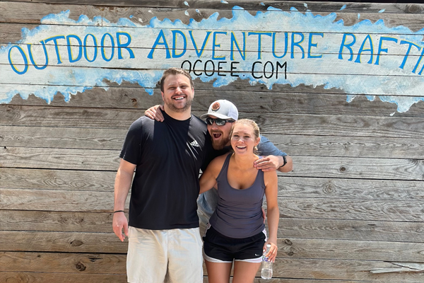 residents in front of the the ocoee sign