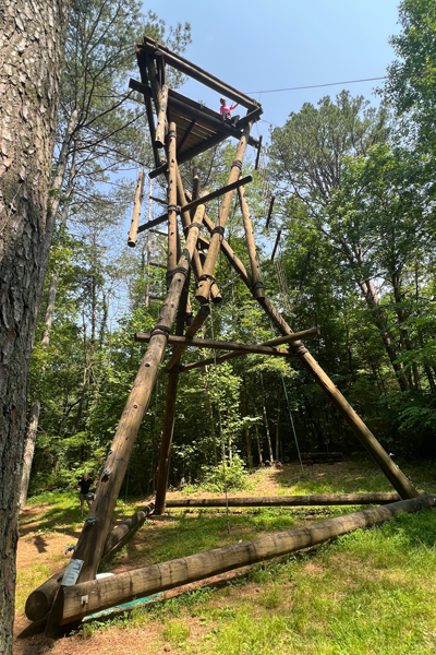 Outdoor photo of resident on a ropes course at Ocoee