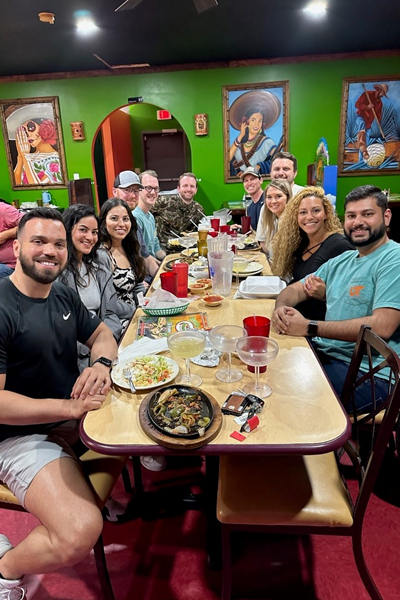 Group photo of residents seated at a table in a Mexican restaurant