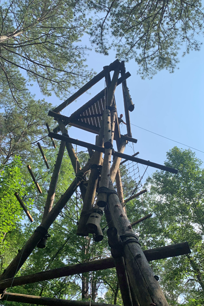 Outdoor photo of resident on a ropes course at Ocoee