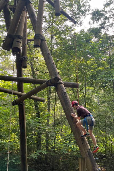 Outdoor photo of resident on the ropes course at Ocoee