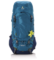 Turquoise blue Dueter women's backpack with yellow flower pinned to it.