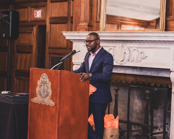 Fellow at podium during graduation