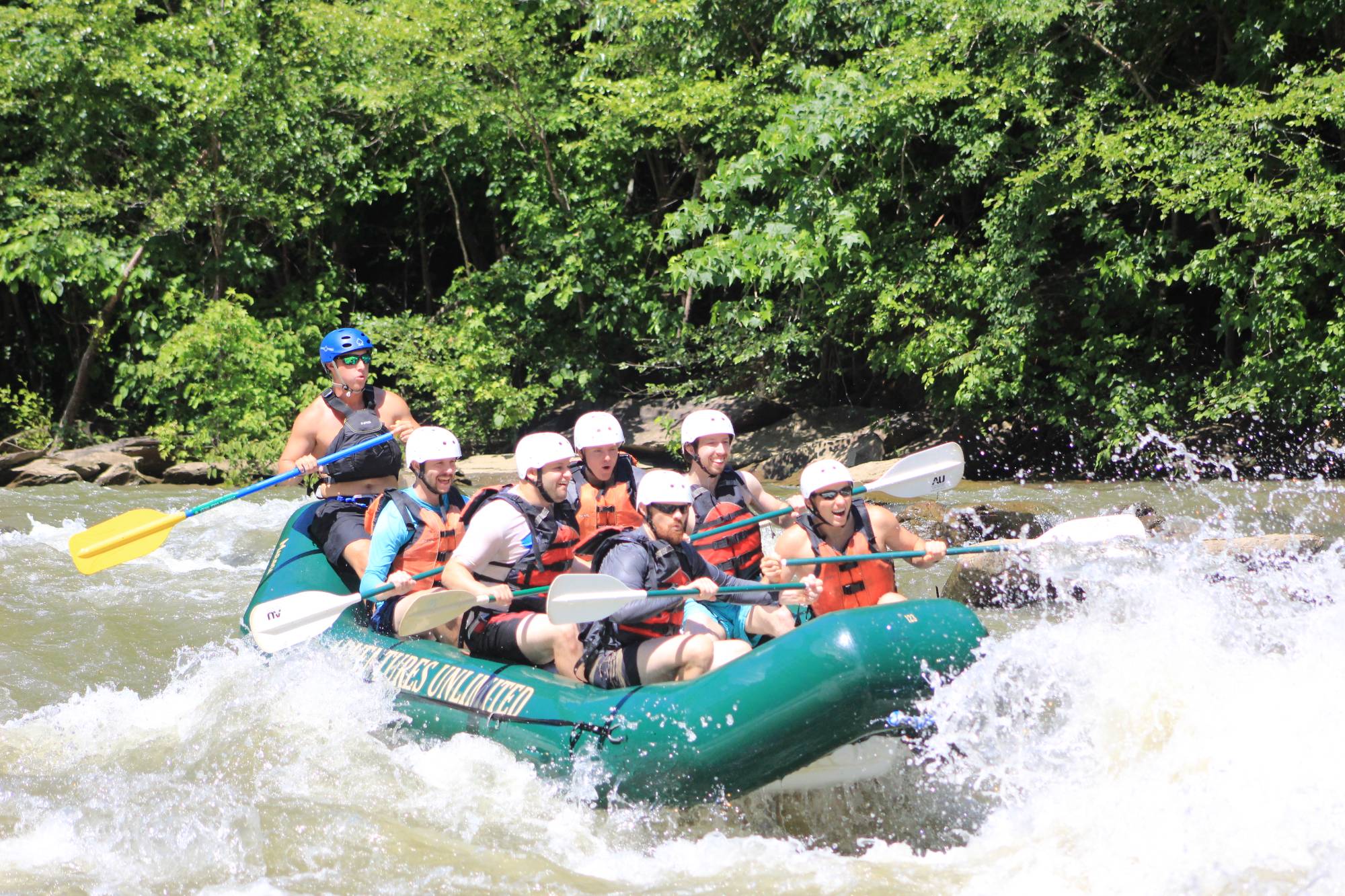 Group rafting on river in 2021