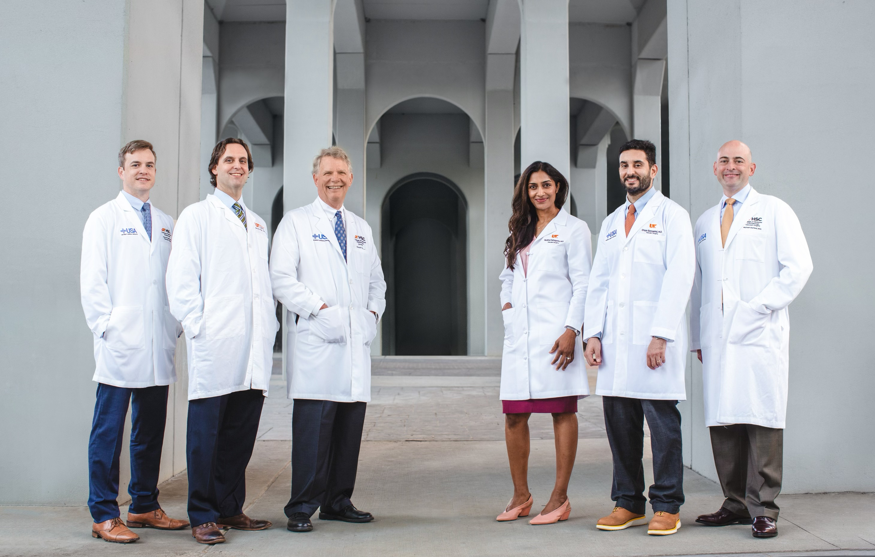 Surgeons standing in front of building