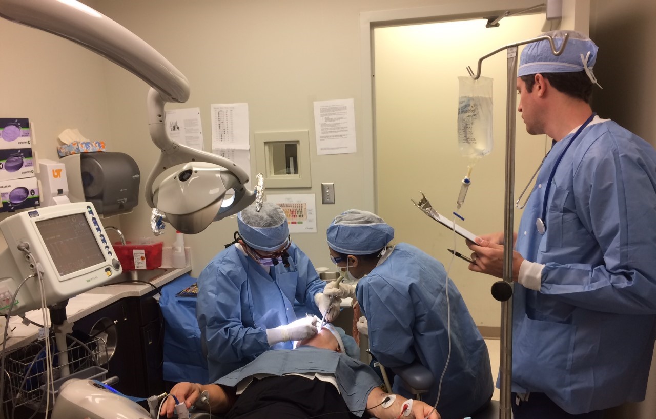 Periodotics graduate students performing a surgery.