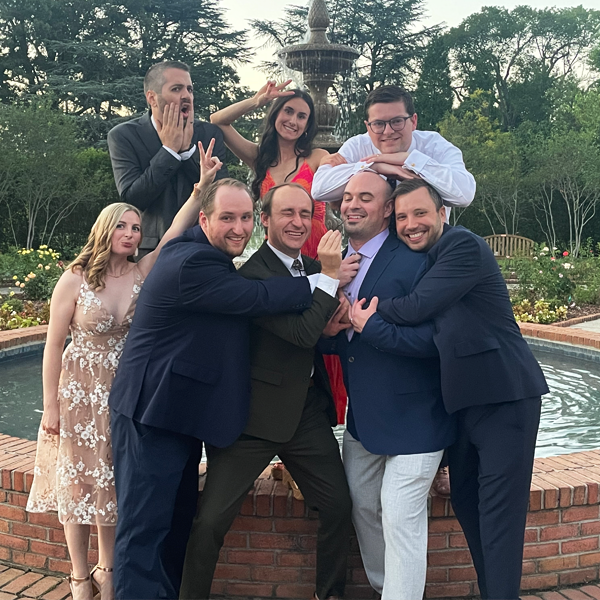 Group of residents posing together outdoors in a courtyard