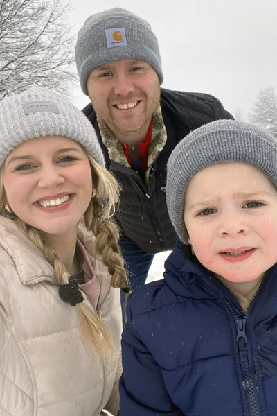 Resident and his family posing outdoors during the winter
