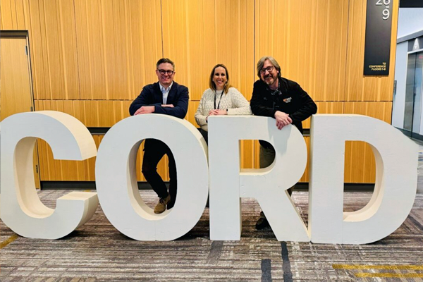 Residents posing inside at a conference