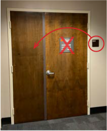Example of a door that has an old sign that needs removing and the correct sign needs to be moved.
