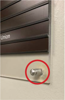 Example of an acrylic sign that has a defective peg.