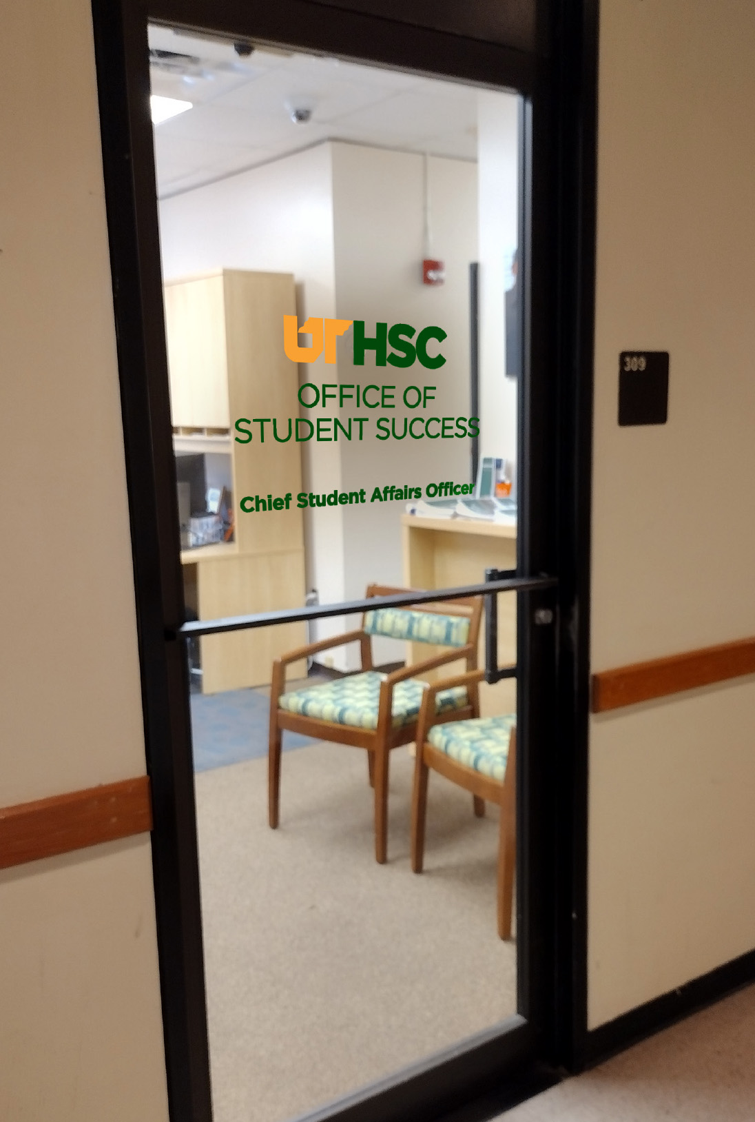 Example of green sign on a glass entrance.