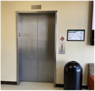 Example of evacuation map next to an elevator.