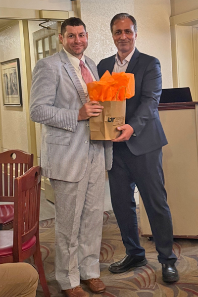 Graduate and faculty posing together