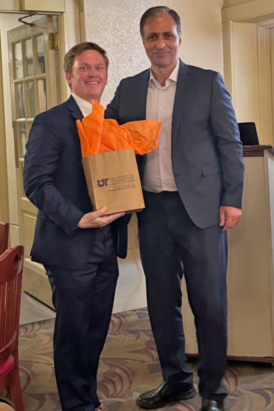 Graduate and faculty posing together