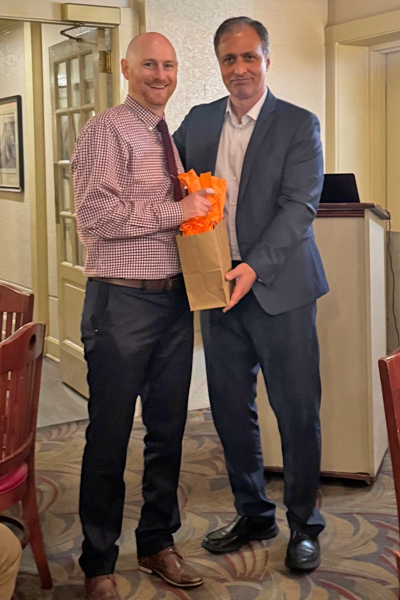 Graduate and faculty posing together