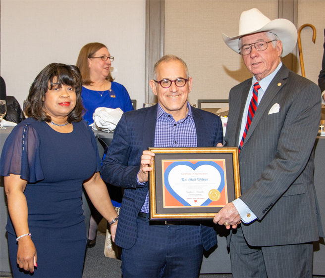 Dr. Wilson receiving an award