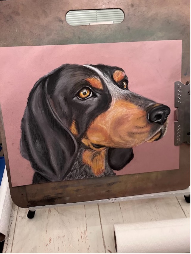 Artwork created by Shannon Hughes of her black and brown dog.