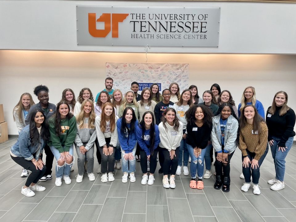 Group of OT students posing together in Madison Plaza.