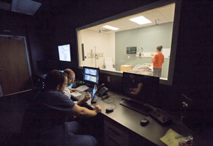 Residents observing the SIM center