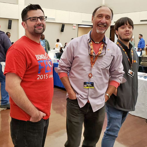 Three male members of the help desk team