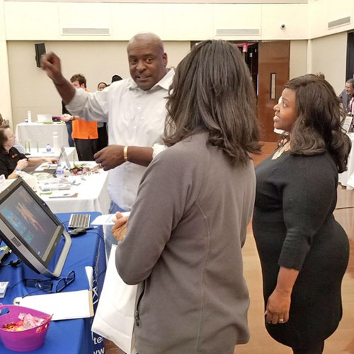 Vendor demonstrating technology at the fair