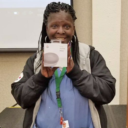 Female prize winner holding her prize