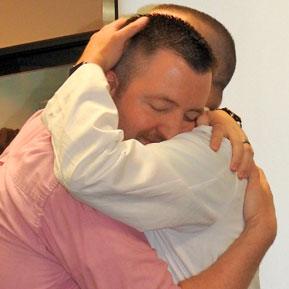 Resident hugging faculty member