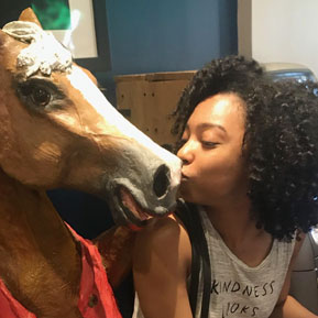 Resident kissing a horse statue