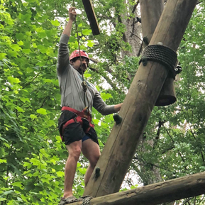 Resident climbing a tree