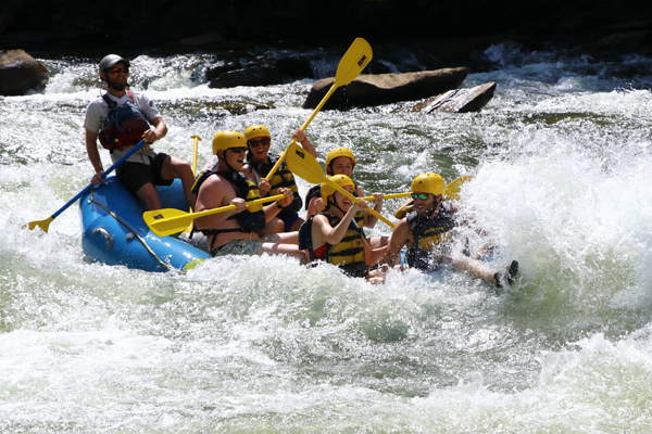 Residents on a raft in the rapids