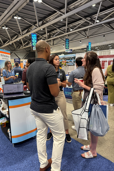 Residents in front of the Family Medicine booth
