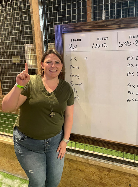 Resident at a throwing axes scoreboard