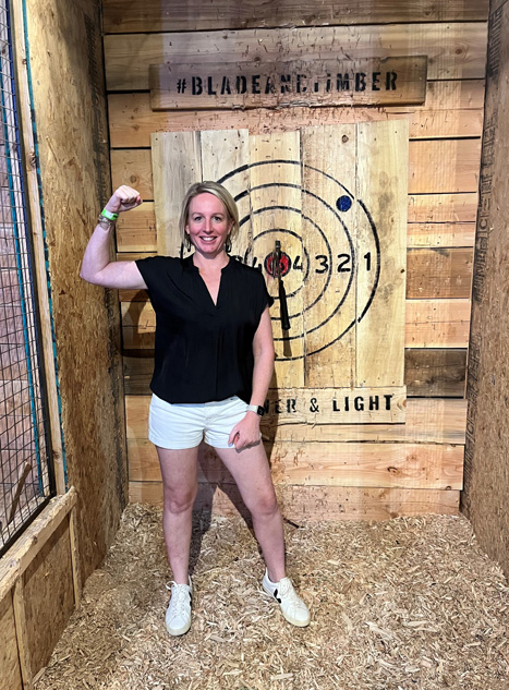 Female resident at axe throwing event