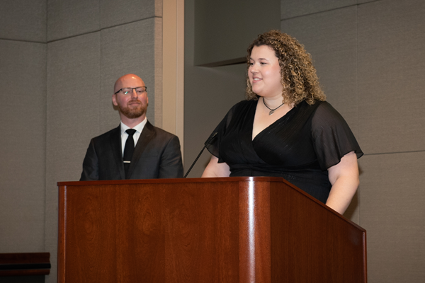 Female resident speaking at the podium