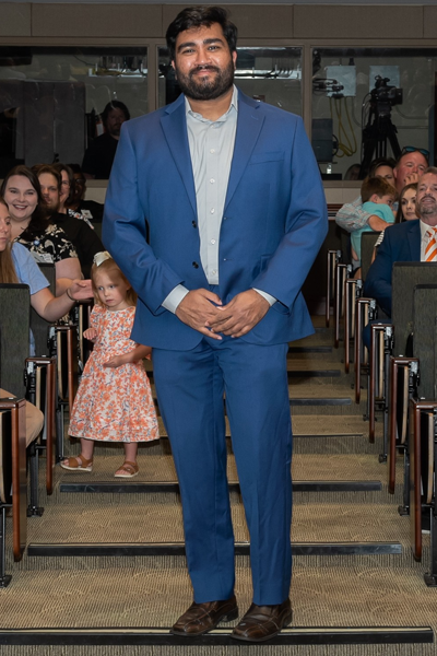 Male walking the aisle at graduation