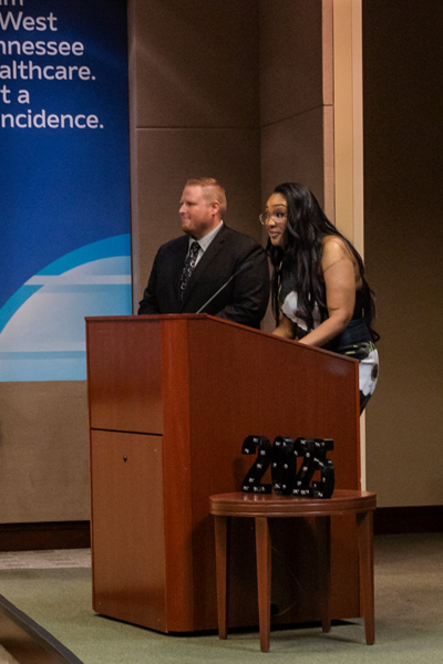 Faculty at podium during graduation