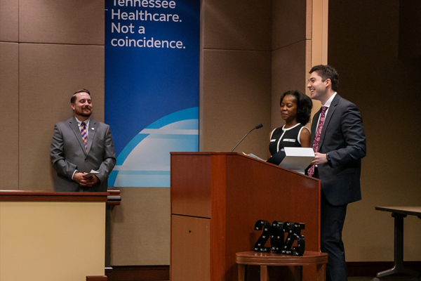 Residents and faculty on stage at graduation