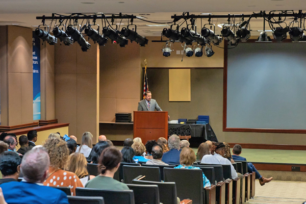 Faculty on stage at graduation
