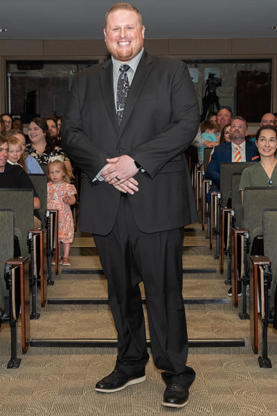 Male walking the aisle at graduation