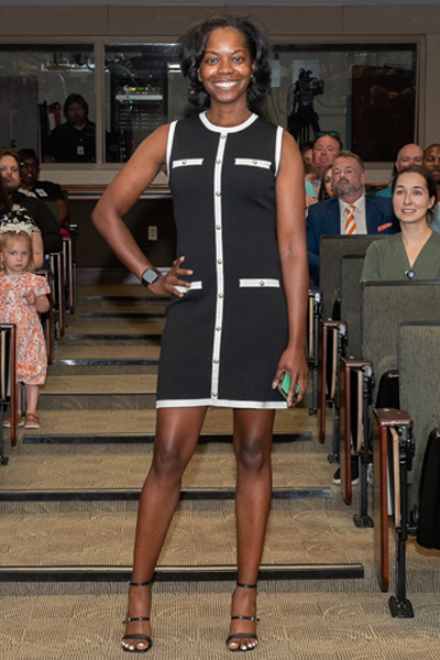 Female walking the aisle at graduation