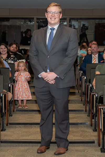 Male walking the aisle at graduation