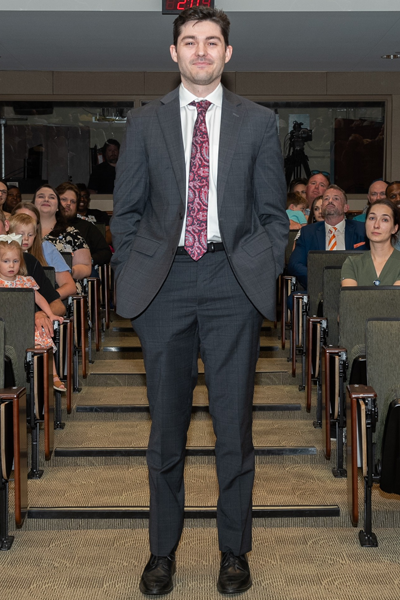 Male walking the aisle at graduation