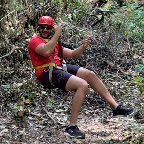 Resident ziplining through trees