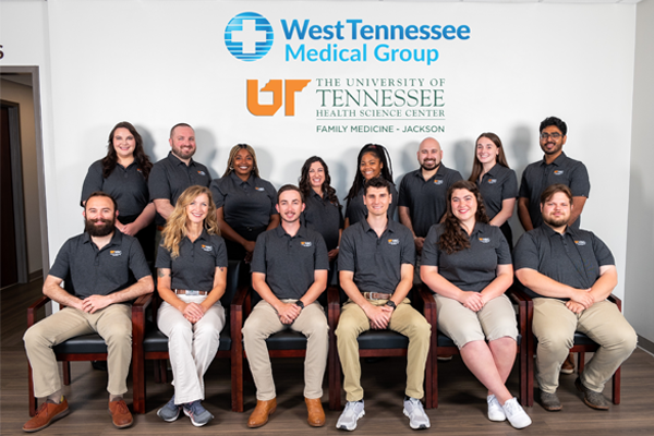 Group photo of incoming residents taken inside