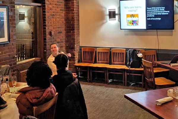 Residents sitting on a table at journal club