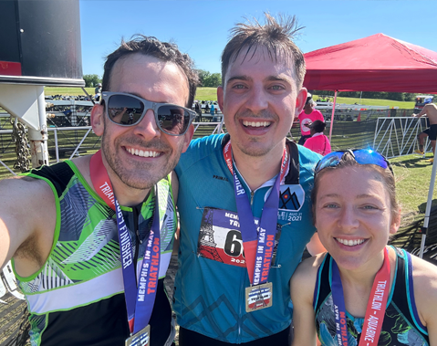 Three residents outside after running a race