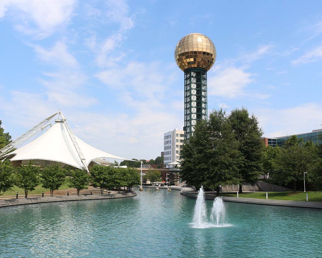 Landscape photo of lake and tower in Knoxville. 