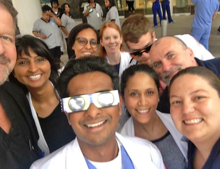 Residents/faculty outside during the solar eclipse